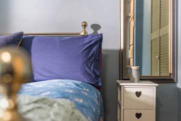The second bedroom is furnished with a king-size bed.