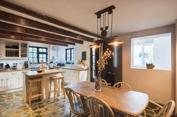 The kitchen/diner leads through to the utility-room and back garden.