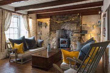 The lovely granite fireplace surrounds the wood-burner, cosy on those cooler days, Although there is no TV reception due to the valley location, a NOW TV entertainment package is provided.