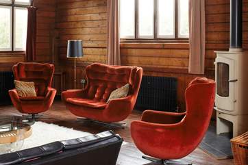 Ample soft seating in the living area with a Log burner for cosy family evenings