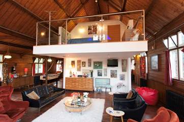 Living area with mezzanine level bedroom above