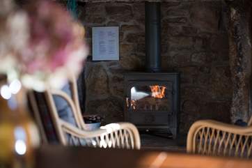 Cosy and warm, relax by the wood-burner.