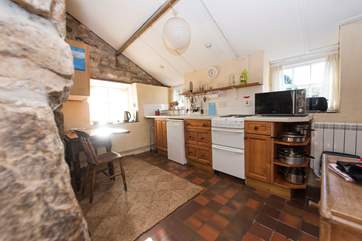 The kitchen is accessed down 3 steep steps.