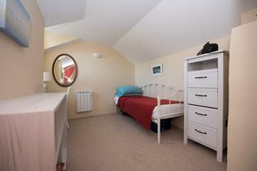 The day bed in the master bedroom is suitable for children.