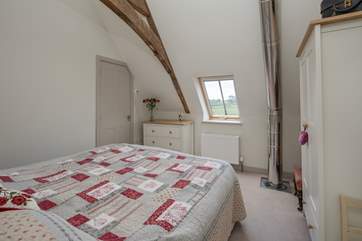 Bedroom 2 has a 5ft king-size bed, which can be split into two 2'6'' single beds, and en suite shower-room. The flue for the wood-burner that comes through the floor has had a safety cage fitted.