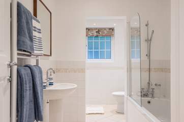 The family bathroom has a bath with shower attachment over as well as a separate shower cubicle.