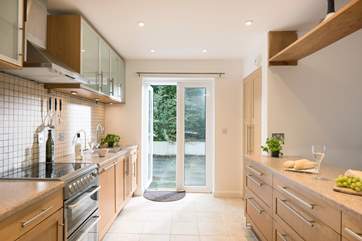 Doors lead out from the kitchen to the patio and parking area.