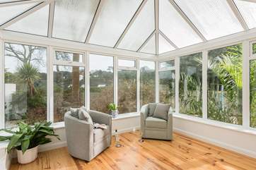 The conservatory is a lovely place to relax with a coffee and the morning papers.