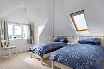 Bedroom 3 on the first floor has twin beds.