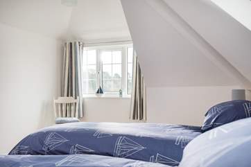 The first floor bedrooms are light and relaxing.