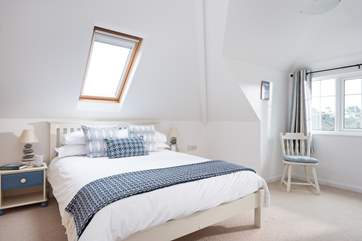 Bedroom 4 has high ceilings and dual-aspect windows.