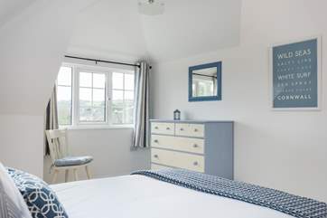 Bedroom 4 looks out towards Swanpool lake and beach.