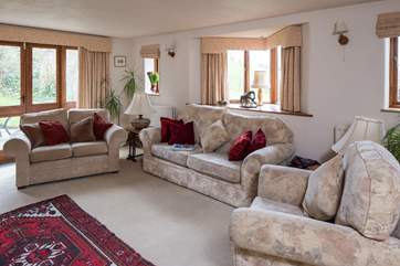 Plenty of space for all the family in the cosy sitting room, which looks out over the garden.