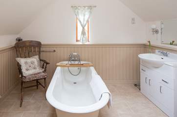 The en suite bathroom for the master bedroom has a hand held shower attachment.
