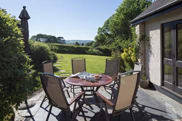 The sheltered south-facing garden is a great place for afternoon tea.