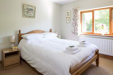 Bedroom 2 has a double bed an looks out over the garden.
