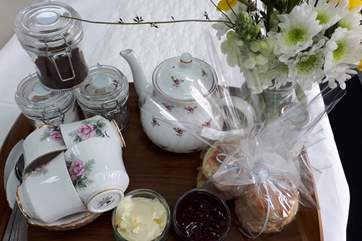 A delightful cream tea awaits your arrival.