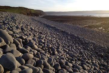The long pebble ridge along the top edge of the beach is a wonderful natural landmark.
