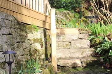 The barn is accessed via a gradually sloping pathway and flight of stone steps to the left of the picture.