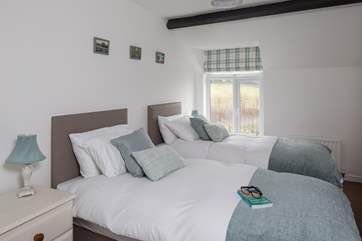 Bedroom 2 offers both comfort and luxury in the form of this inviting zip and link bed, with a wonderful view to wake up to.