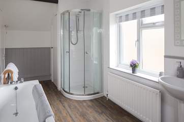Spacious and airy bathroom, which offers both a shower and bath. Whether it's a quick shower, or a long soak in the bath you are after, this bathroom offers both.