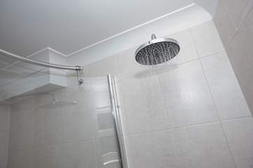 The fully tiled shower-room has a walk-in shower.