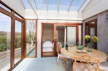 Grab a glass of wine and relax in the conservatory with spectacular views across the harbour