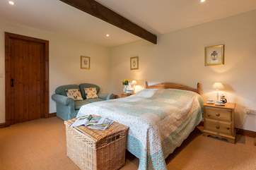 This bedroom is really spacious - room for a sofa too!