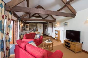 High ceilings and beams give this lovely barn conversion plenty of character.