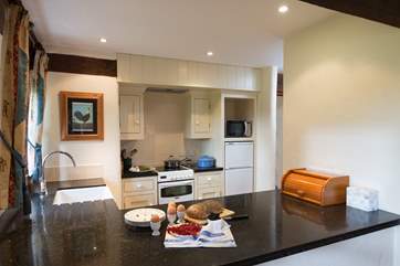 The wide granite worktop gives you plenty of space to prepare meals.