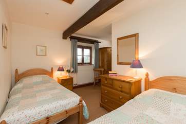 The twin bedroom is at the opposite end of the cottage.