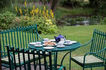 Enjoy sitting out on the patio in this tranquil garden.