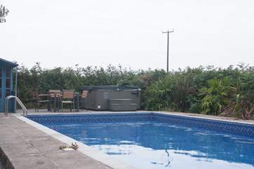 The outdoor heated swimming pool (the hot tub at the far end of the picture is not available).