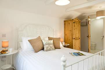 The en suite shower-room leads off from the bedroom.