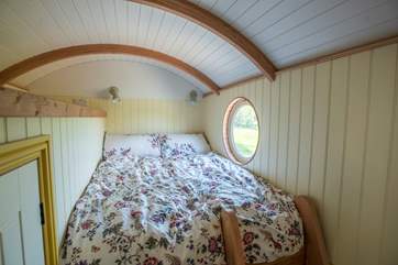 The comfy double bed is accessed by a ladder.