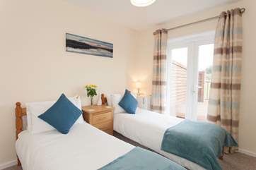 On the ground floor is a sweet and light, twin bedroom