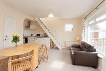 With comfortable seating and a table for family meals there is a good area to gather the family in the evenings