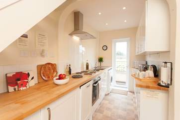 The cottage has a lovely galley kitchen, a pretty area to cook up a feast