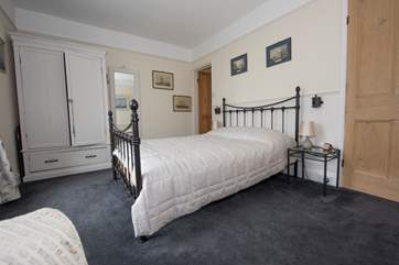 Bedroom 1 with the entrance to the en suite bathroom in the far right-hand corner.