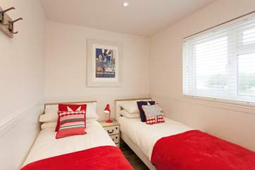 The cosy twin room has views out to the peaceful nature reserve.