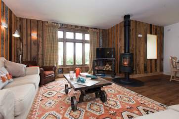 The sitting-area is warmed by a huge Morso wood-burner.
