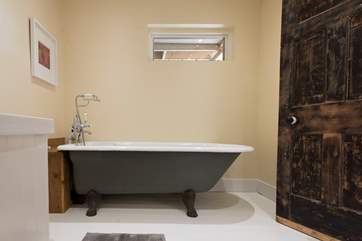 The bathroom is stylish and luxurious.