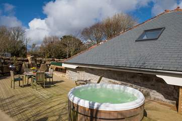 The hot tub and terrrace are to the rear of the cottage, ensuring complete privacy.