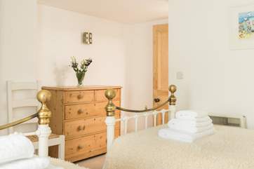 This lovely twin bedroom is a great space for adults and children.