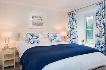 The pretty master bedroom has a comfy 5' double bed.