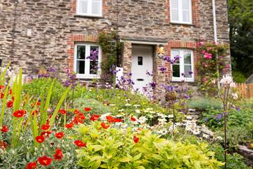 The borders leading up to the front door, full of spring flowers
