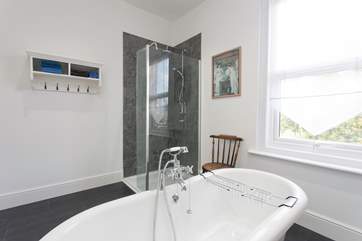 Take a relaxing soak in the roll-top, claw-foot spectacular bath.