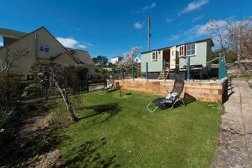 This beautifully built shepherd's hut is snuggled into the corner of the owner's garden, with a private entrance, enclosed patio and lawned garden.