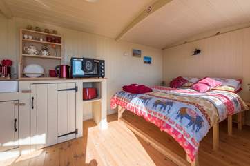 Inside, a super comfy double bed awaits, you can listen to the waves on the shore below.