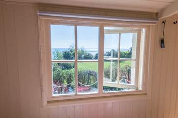 This shepherd's hut is built to a very high standard with beautiful joinery. What a view from the bedside window!